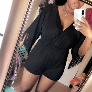 A black, fringed romper